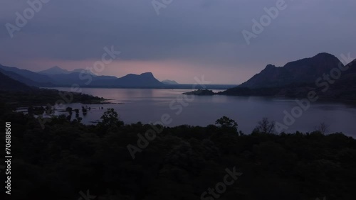 Panoramic drone shot of Palar Dam Reservoir at sunset under an overcast sky, Tamil Nadu, India photo