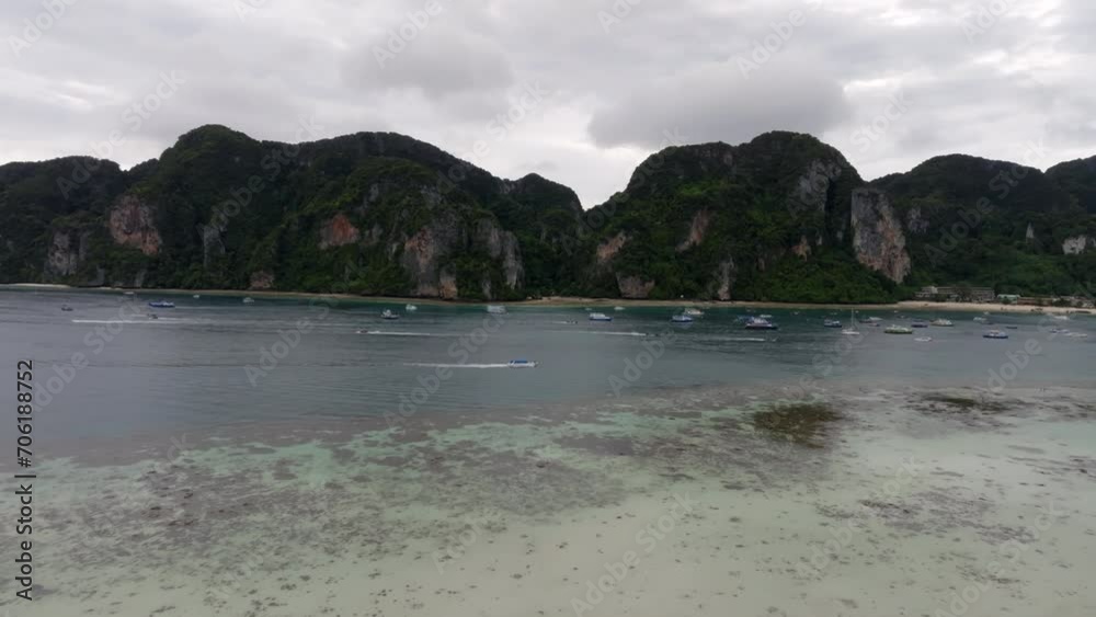 Drone footage from PhiPhi islands in Thailand footage of incredible Thai landscapes incredible nature with insane rocks, beaches, hills, ocean adn boats. Footage. filmed in 4k