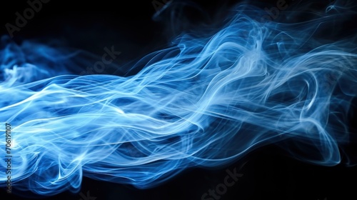  a close up of a blue and white object with smoke coming out of it's back end and a black background.
