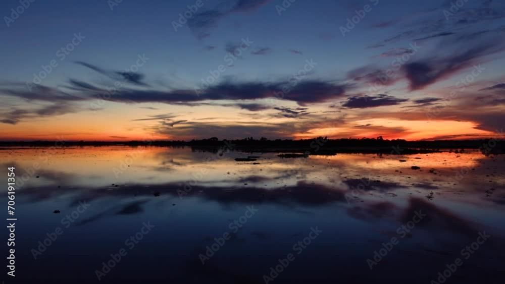 Beautiful sunrise. Evening blue-orange sky view in Haor region. Blue and Orange sky with dramatic clouds. Beautiful sunrise. Evening blue-orange sky view in Haor region. Blue and Orange sky with dramatic clouds.