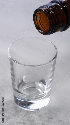 Whiskey Pouring into shot glass photo