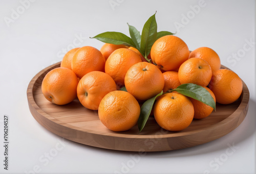 tangerines on a table, oranges chinese new year traditional fruits in a wooden plate, isolated white background