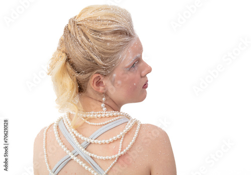 Portrait of a blonde girl in snowflakes. Photo in the studio