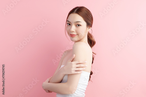 Beautiful young asian woman with clean fresh skin on pink background, Face care, Facial treatment, Cosmetology, beauty and spa, Asian women portrait.