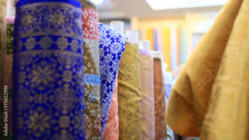 Rows of fabrics in a textile shop at Mayestik Market, Jakarta, Indonesia.