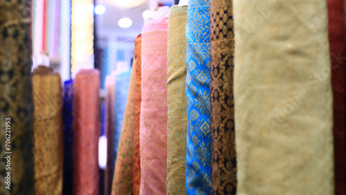 Rows of fabrics in a textile shop at Mayestik Market, Jakarta, Indonesia.