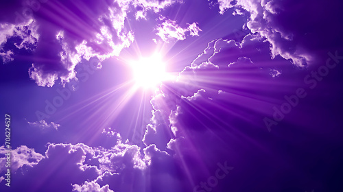 A cross between the rays of the sun. Purple clouds sky. Christian Holy Week. Easter