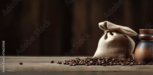 bunch of fresh roasted coffee beans with burlap sack on a wooden table. agriculture and drink concept