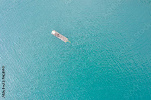 fishing boat over lake in aerial view
