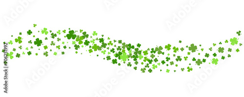 St. Patrick Day shamrock clover background. Wavy vector border with flying green leaves for posters banners and greeting cards.