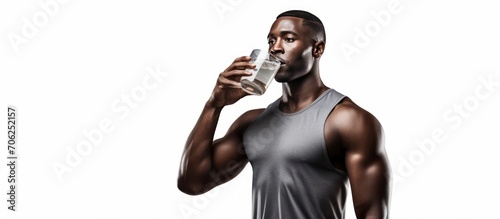 Drinking water, fitness and gym with a black man athlete taking a break from his exercise or workout routine.