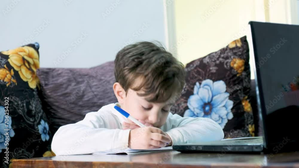 Arabic man teaching his kid in home during quarantine and supporting his kid learning Arabic man teaching his kid in home during quarantine and supporting his kid learning