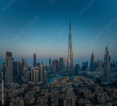 Golden Dawn: Aerial Majesty of Dubai's Skyline Bathed in Sunrise Splendor (ID: 706258333)