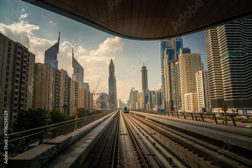 Dubai's Urban Journey: Railway Perspective with Majestic City Skyline photo