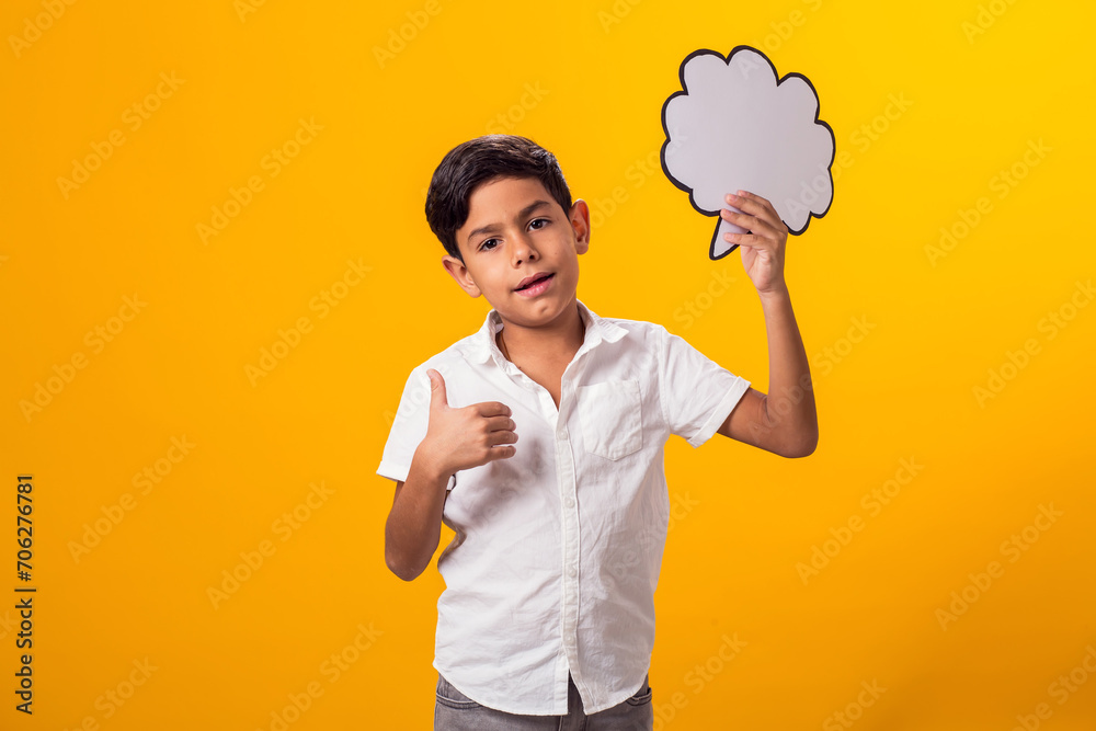 Child boy holding think cloud bubble card. Dreaming concept Child boy holding think cloud bubble card. Dreaming concept