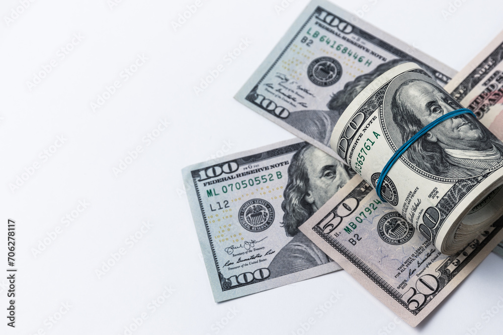 Roll of american dollars on a white background. Financial concept. Roll of american dollars on a white background. Financial concept.