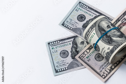 Roll of american dollars on a white background. Financial concept.