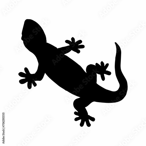 silhouette of a black lizard crawling