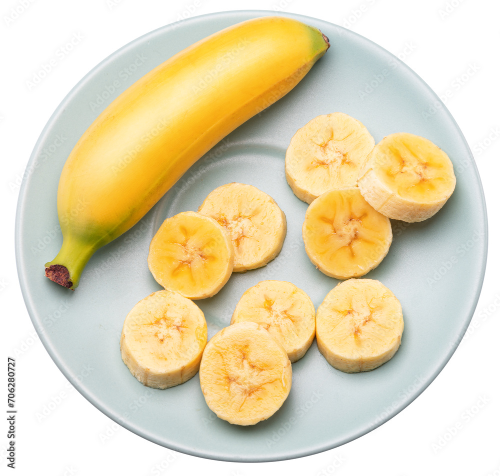 Baby banana and banana slices on blue plate. File contains clipping path. Top view.