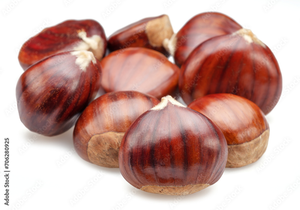 Edible sweet chestnuts isolated on white background. Edible sweet chestnuts isolated on white background.