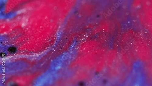 Fluid mix background. Sparkling liquid. Sequins ink art. Blur blue pink black shiny grain texture wet dye abstract splatter waves flow motion. photo