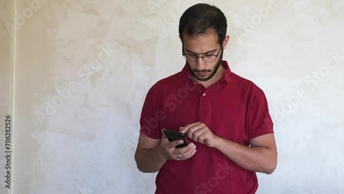 portrait for an Arabian man is talking to someone using his mobile phone to understand and grasp how to solve an issue or problem that occurs
