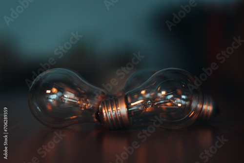 Light bulbs on the table. Wooden table. Background image. Lots of non-working light bulbs. No light. Selective Focus