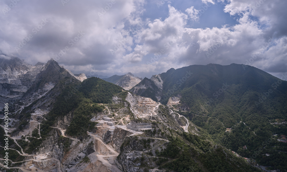 Aerial panorama of marble quarries Carrara Italy. Marble quarry in the mountains at high altitude. Marble quarry top view. Aerial panorama on the Carrara marble quarry.