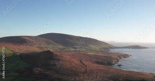 Spectacular 4K aerial video of flying above picturesque Atlantic coast at sunset, Sybil Head, Dingle Peninsula, Kerry, Ireland photo