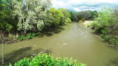 stormy dirty river during flood