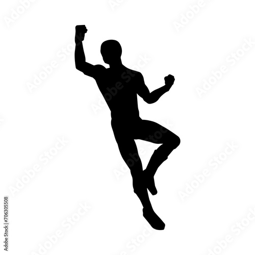 Silhouette of a man in oriental martial art pose. Silhouette of a male in martial art move.