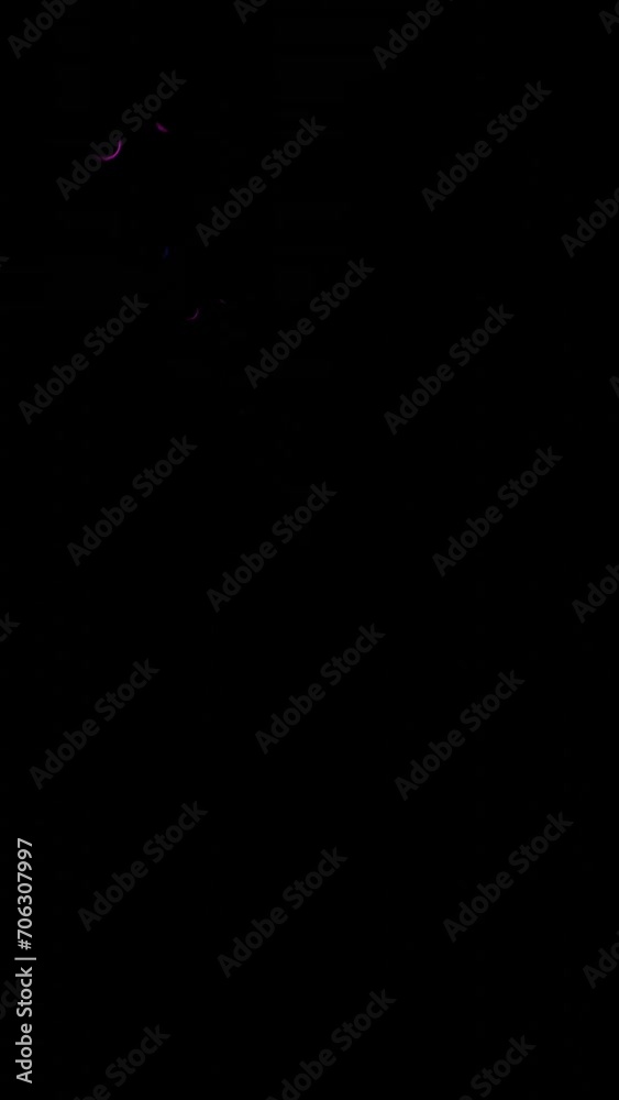This stock vertical motion graphic shows bright highlights on a black, dark background. This abstract background in vertical format will decorate your projects, stories, will become a wonderful wallpa This stock vertical motion graphic shows bright highlights on a black, dark background. This abstract background in vertical format will decorate your projects, stories, will become a wonderful wallpa