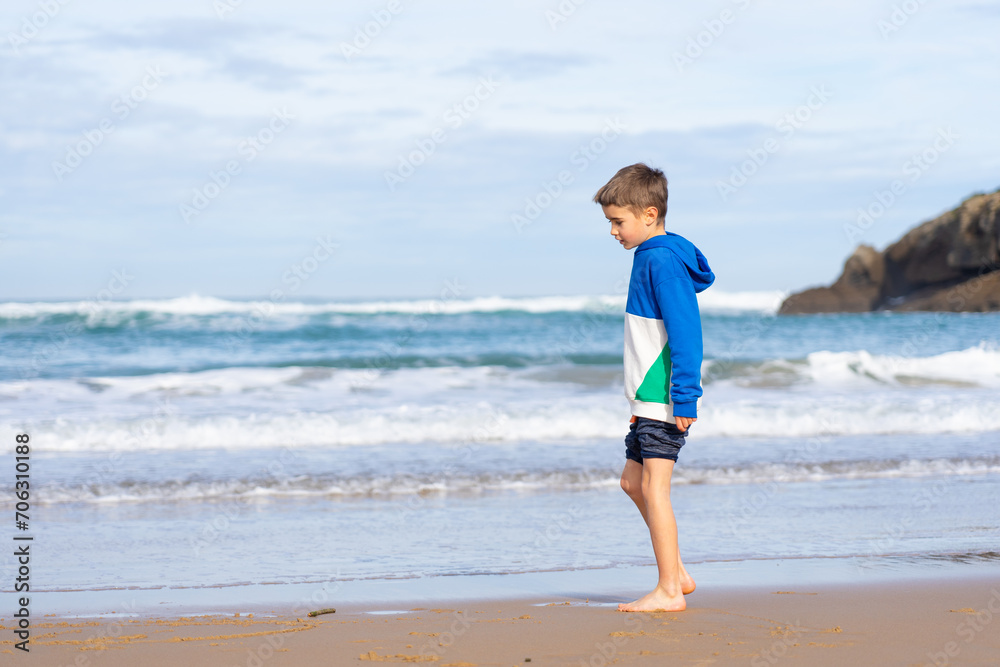 Barefoot boy on the seashore