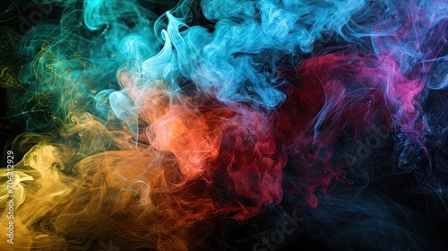 Colorful blue, red and yellow smoke on a black isolated background