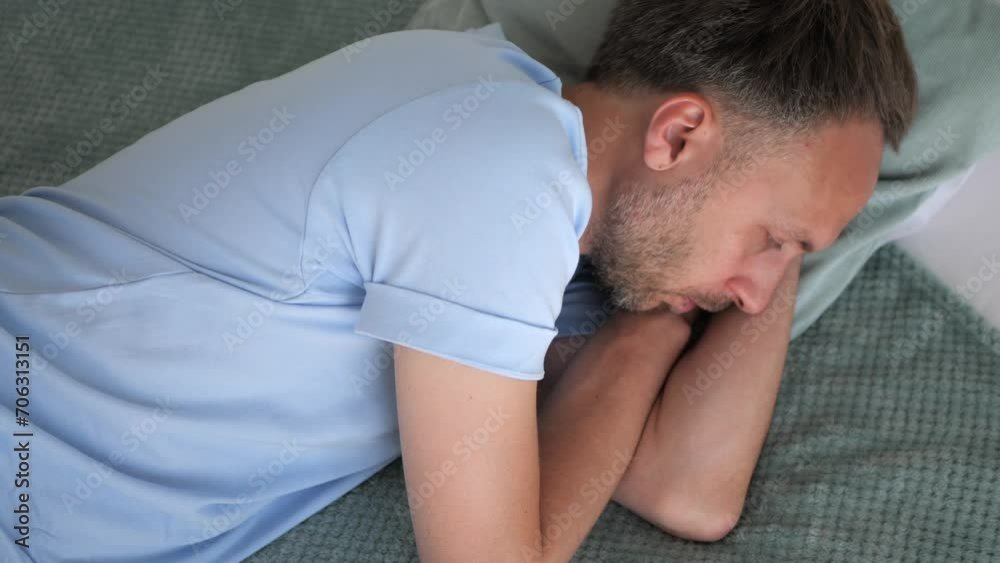 Man in bed lying with open eyes, top view. Insomnia problems with sleep or stressed person in depression alone at home, mental health concept Man in bed lying with open eyes, top view. Insomnia problems with sleep or stressed person in depression alone at home, mental health concept
