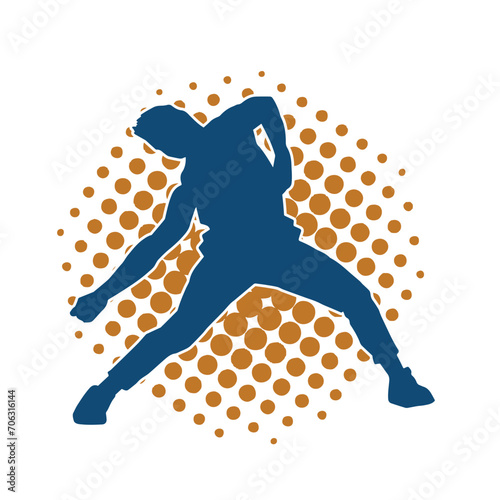 Silhouette of a slim male in dance pose. Silhouette of a man dancing. photo