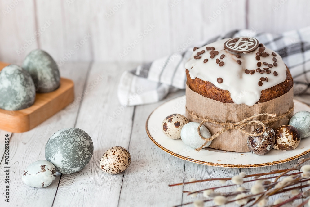 Stylish grey Easter eggs in the color of marble, concrete, willow branches and Easter cake on a white wooden background. Coloring eggs with natural dye karkade tea. Environmental friendliness. Stylish grey Easter eggs in the color of marble, concrete, willow branches and Easter cake on a white wooden background. Coloring eggs with natural dye karkade tea. Environmental friendliness.