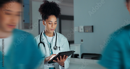 Tablet, healthcare doctor and happy woman typing online research, medicine study and smile for wellness, test exam results. Hospital web info, scroll and nurse reading clinic review, feedback or news photo