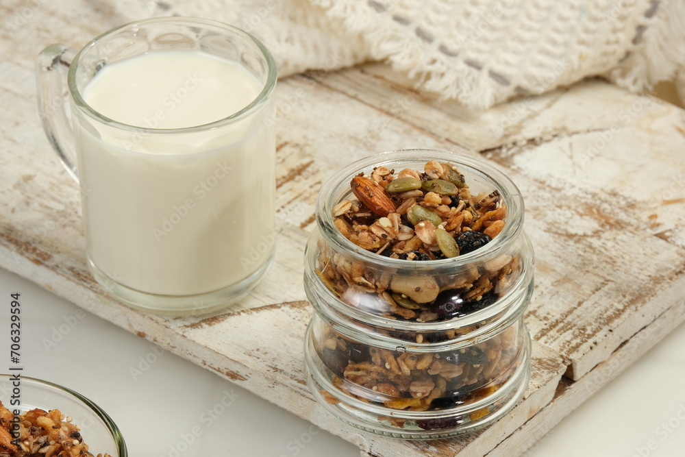Healthy Breakfast,Granola With Glass of Milk on White Background Healthy Breakfast,Granola With Glass of Milk on White Background