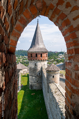 View from the embrasure of a tower at Kamyanets-Podilsky medieval fortress, located in the historic city of Kamianets-Podilskyi, historic region of Podolia, Ukraine. photo
