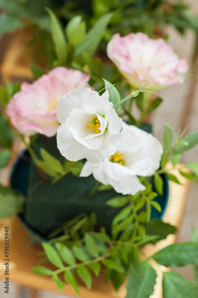 Fototapeta premium Close up of Eustoma russellianum bouquet. Vertical photo orientation.