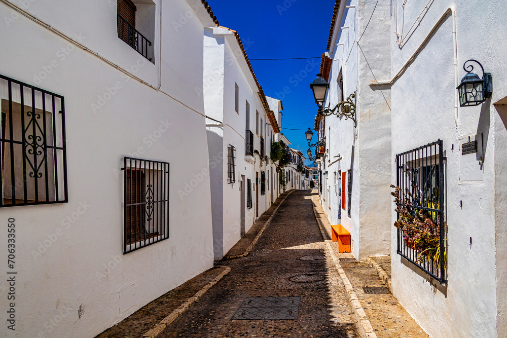urban narrow street in the Spanish city of Altea on a summer day