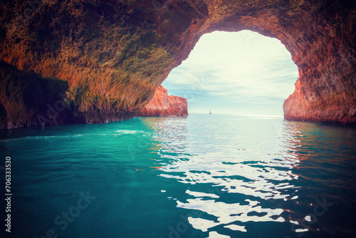 Coastal rocky seascape. Entrance in Benagil cave in Algarve region. Atlantic Ocean, Portugal, Europe photo