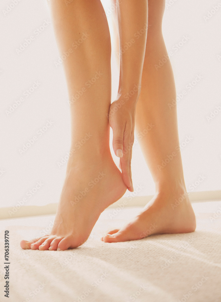 Woman Applying Body Lotion on Foot, Low Section
Woman Applying Body Lotion on Foot, Low Section