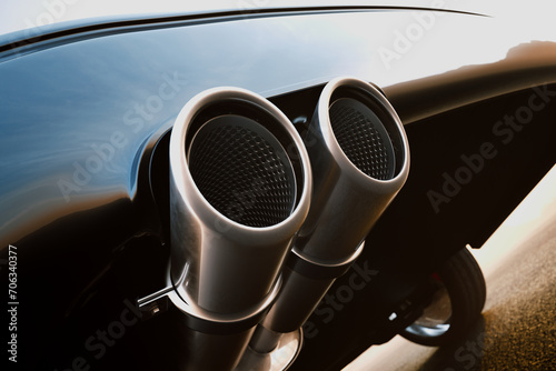 Sleek Dual Exhaust Pipes on a High-Performance Sports Car's Rear photo