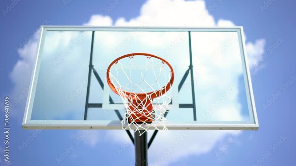 Looking up at basketball backboard and hoop against clear blue sky Looking up at basketball backboard and hoop against clear blue sky