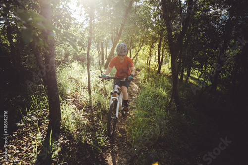 Mountain biking on spring forest trail