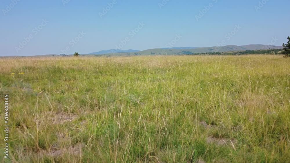 Aerial drone view of a countryside hilly landscape in summer colors. Aerial drone view of a countryside hilly landscape in summer colors.