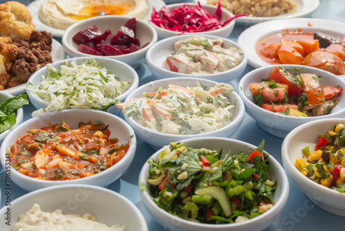 Still life close up variety of Israeli meze appetizers in bowls
 photo