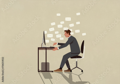 Businessman overwhelmed with emails at computer
 photo